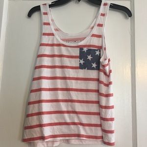 Red and white striped tank. Blue stars on pocket.